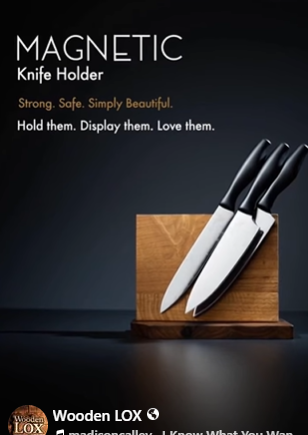 Handcrafted Wooden LOX magnetic knife holder made of walnut and oak wood with three black-handled kitchen knives attached.