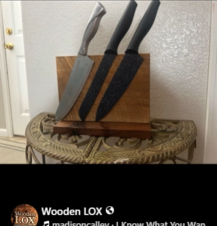 Handcrafted Wooden LOX magnetic knife holder made of walnut and oak wood with three black-handled kitchen knives attached.