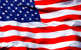 American flag waving with a blurred background