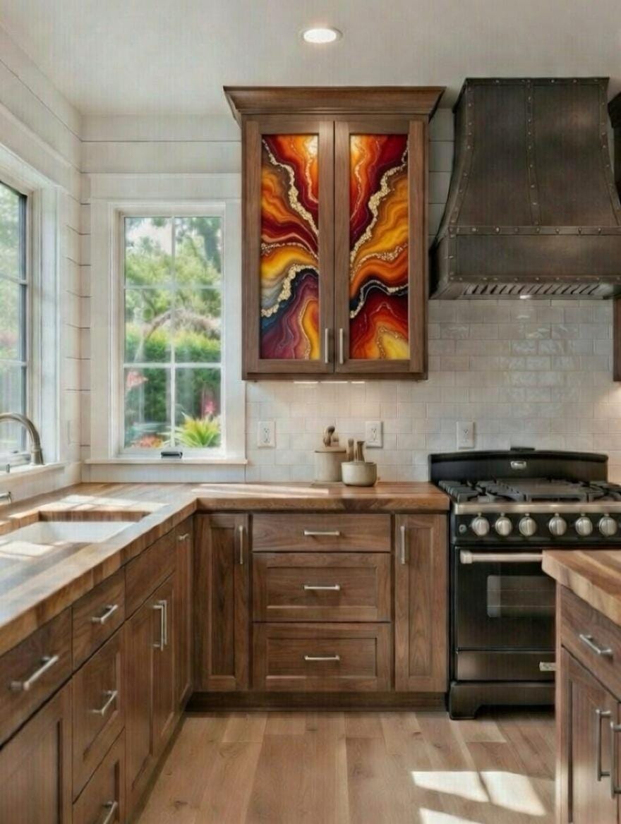 This image features a rustic-style kitchen highlighted by custom epoxy resin art panels integrated into the upper cabinet doors. 