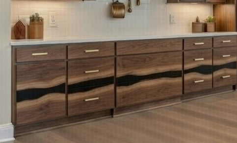 Book-matched oak slab cabinet doors featuring a continuous black epoxy river running horizontally through the wood grain.
